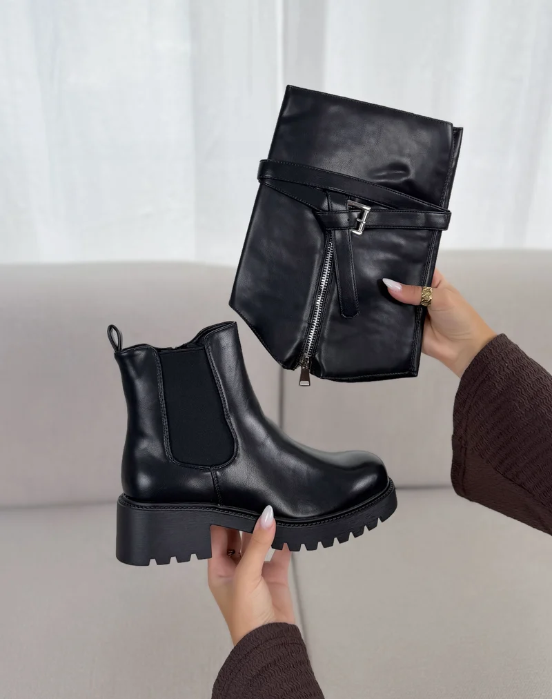 BottInes femme noires tendance à semelle crantée et boucle argentée
