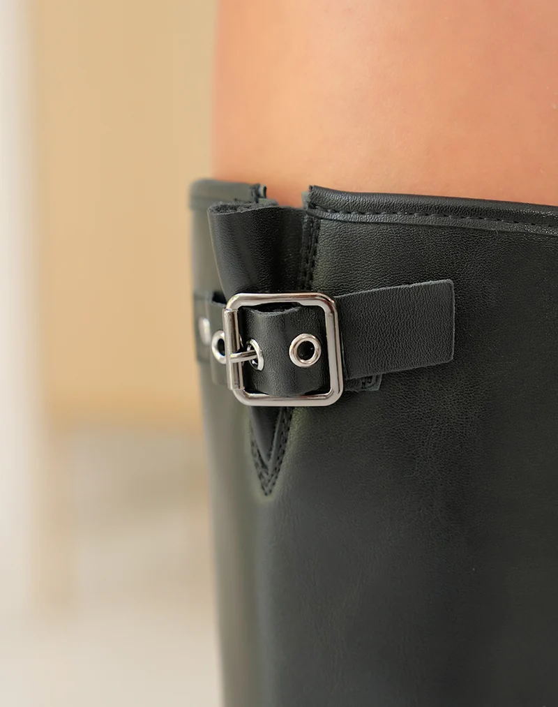 Bottes noires à lanières à boucle argentée pour femme