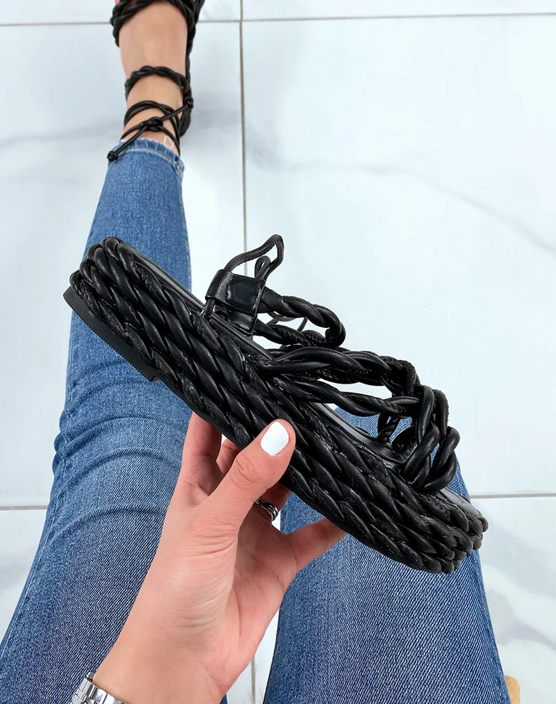 Compensées noires à longues lanières et semelle tressée
