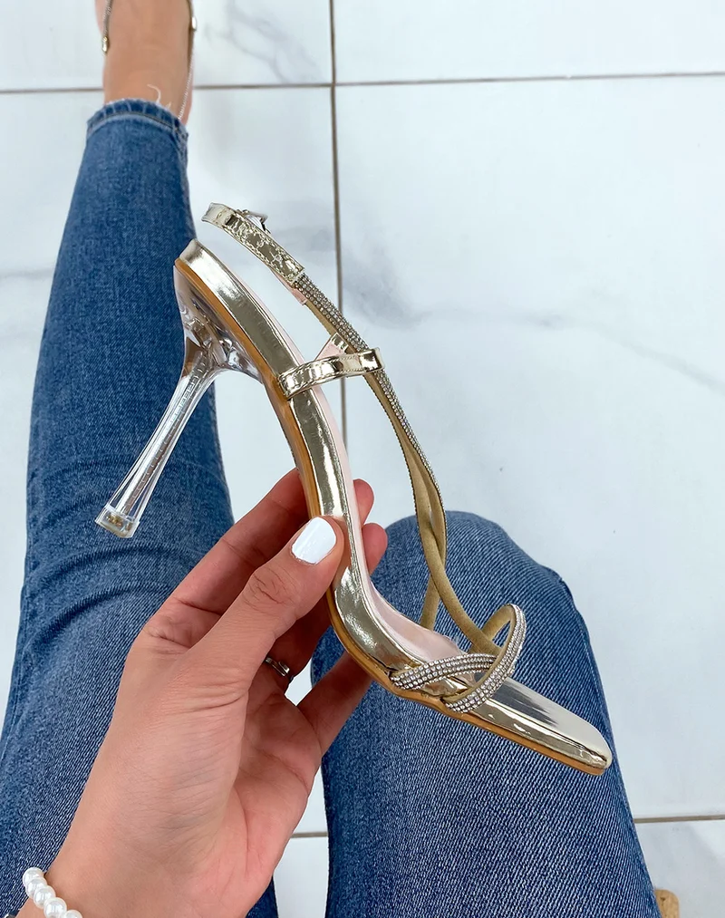 Sandales dorées à strass et talon aiguille transparent