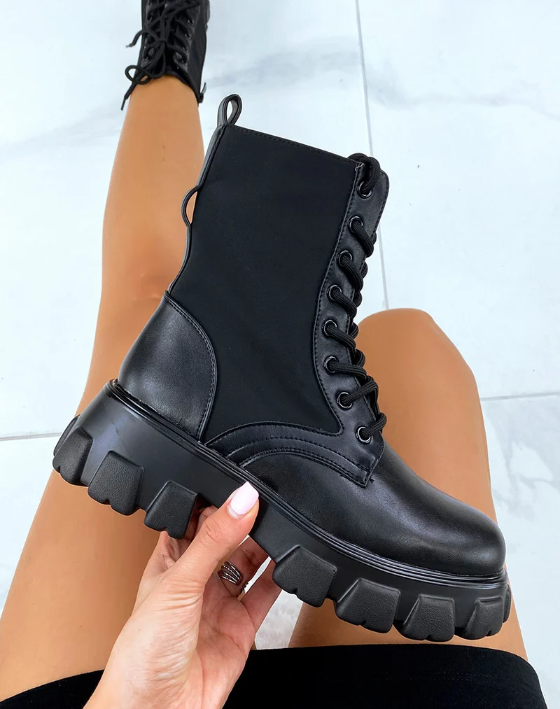 Bottines noires lacées en bi-matière à pochette et à semelles crantées
