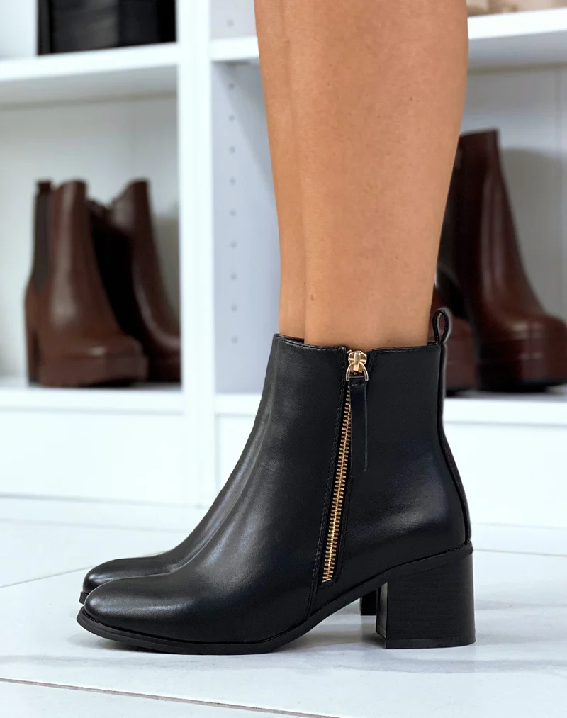 Bottines noires à zip doré et petit talon