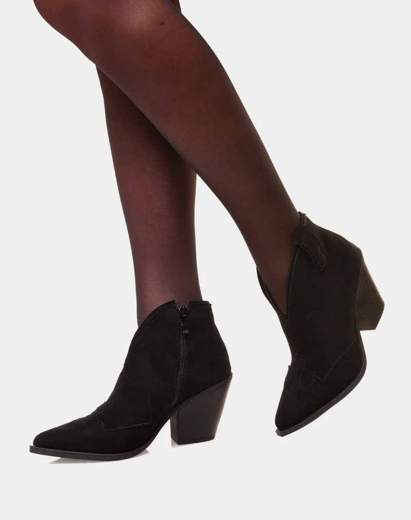 Bottines noires en suédine à bout pointu et à talon biseauté