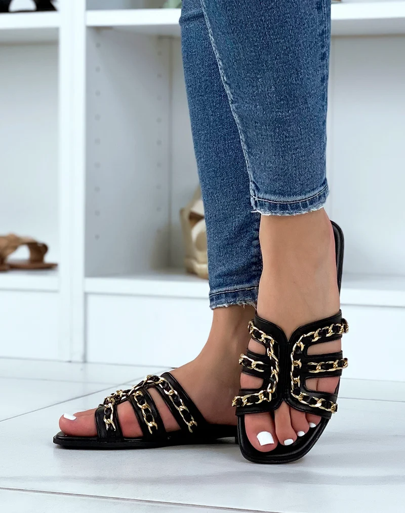 Mules noires à brides ouvertes croisées à chaîne dorée