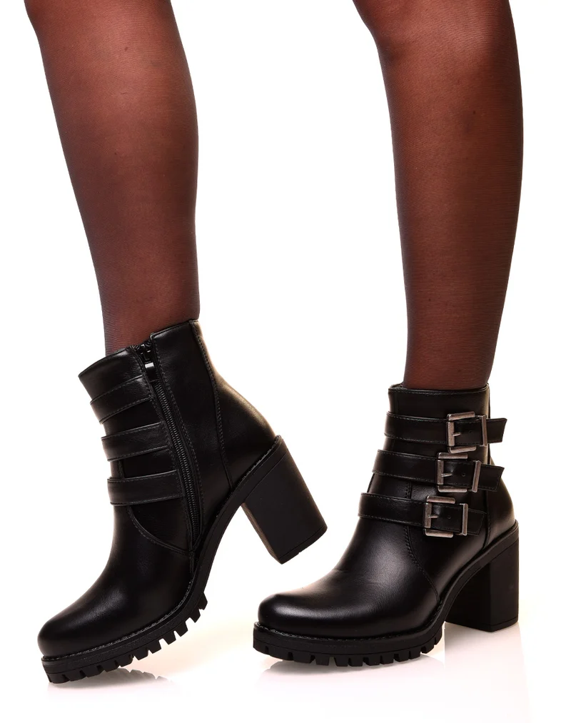 Bottines noires à talons et à sangles