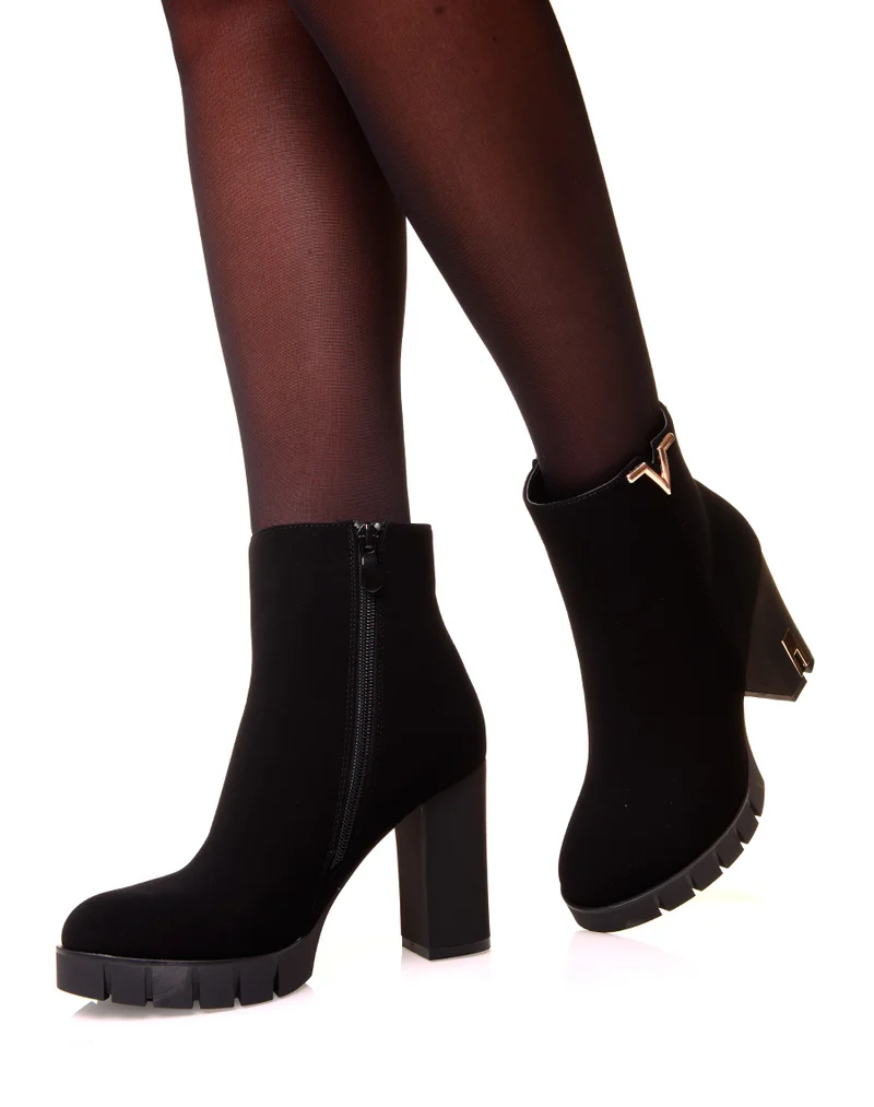 Bottines noires à talons en suédine à détails dorés