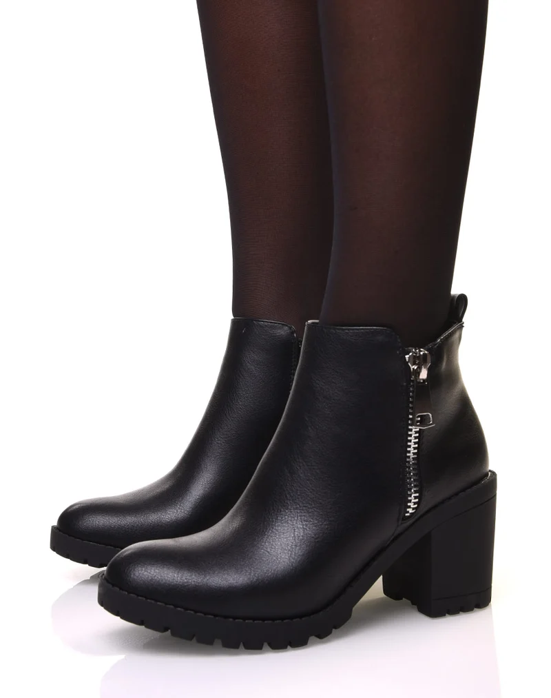 Bottines noires à talons et semelle crantée