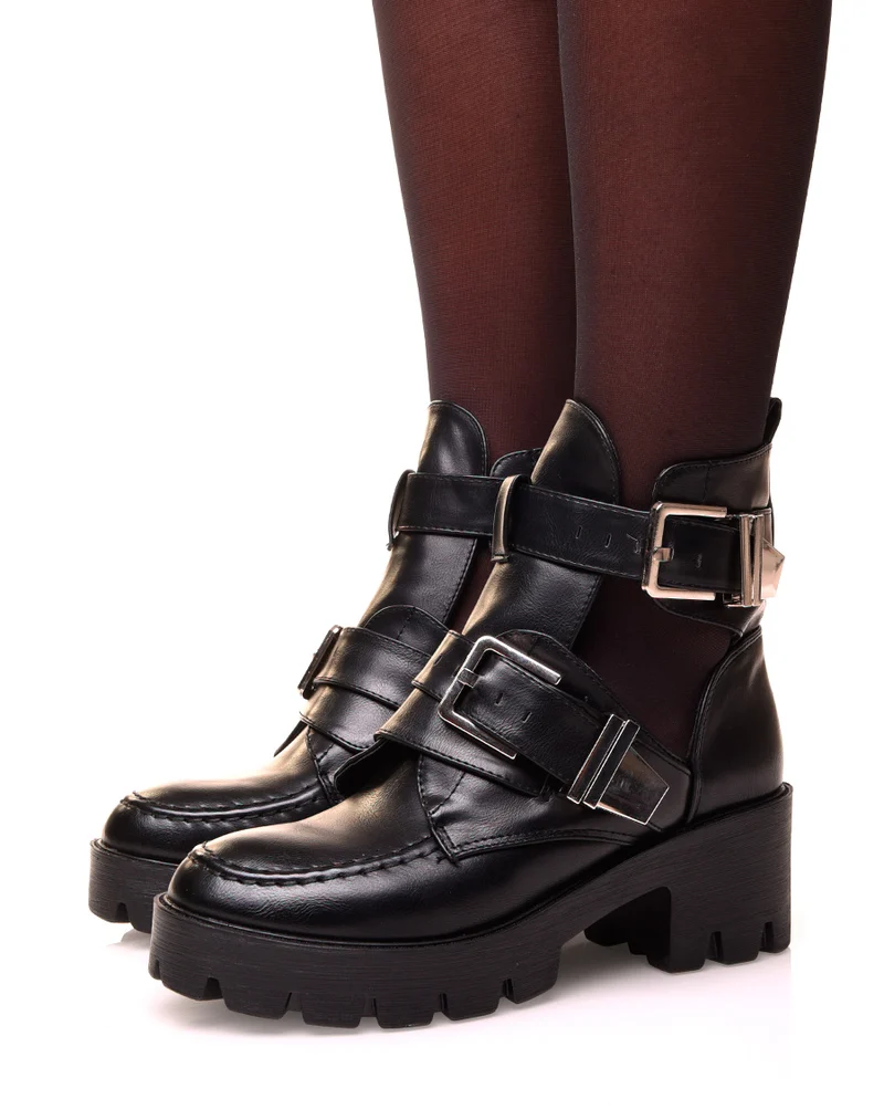 Bottines noires montantes ouvertes ajourées de boucles