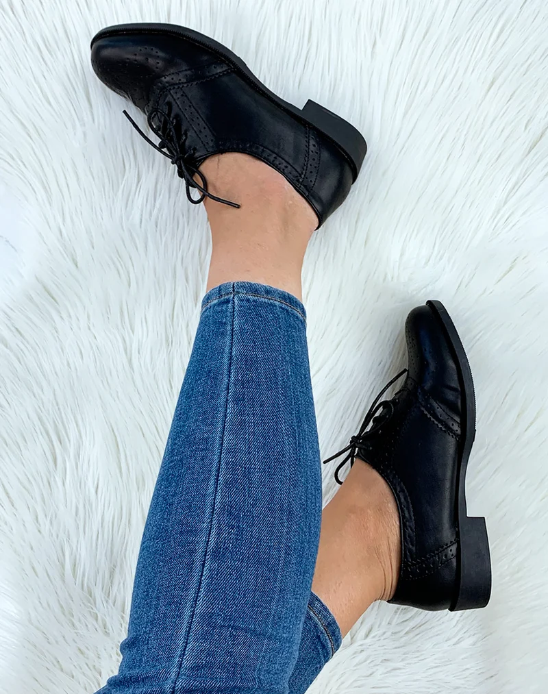 Derbies noires surpiquées à lacets