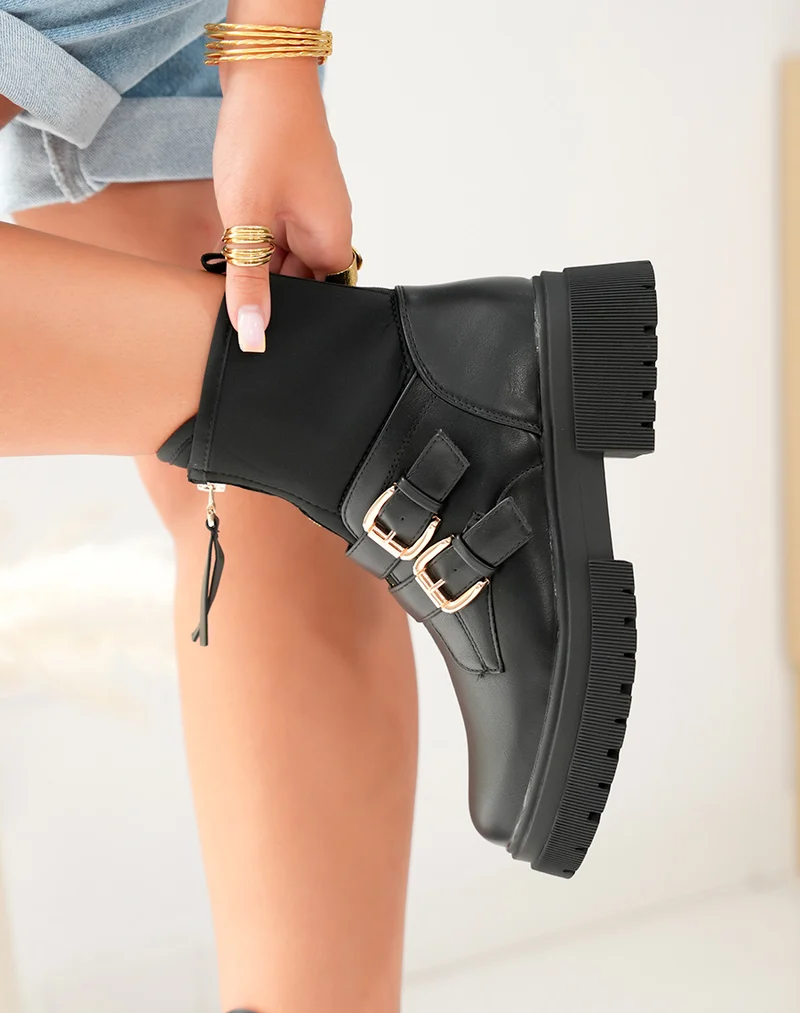 Bottines noires: Zippé et détails dorés