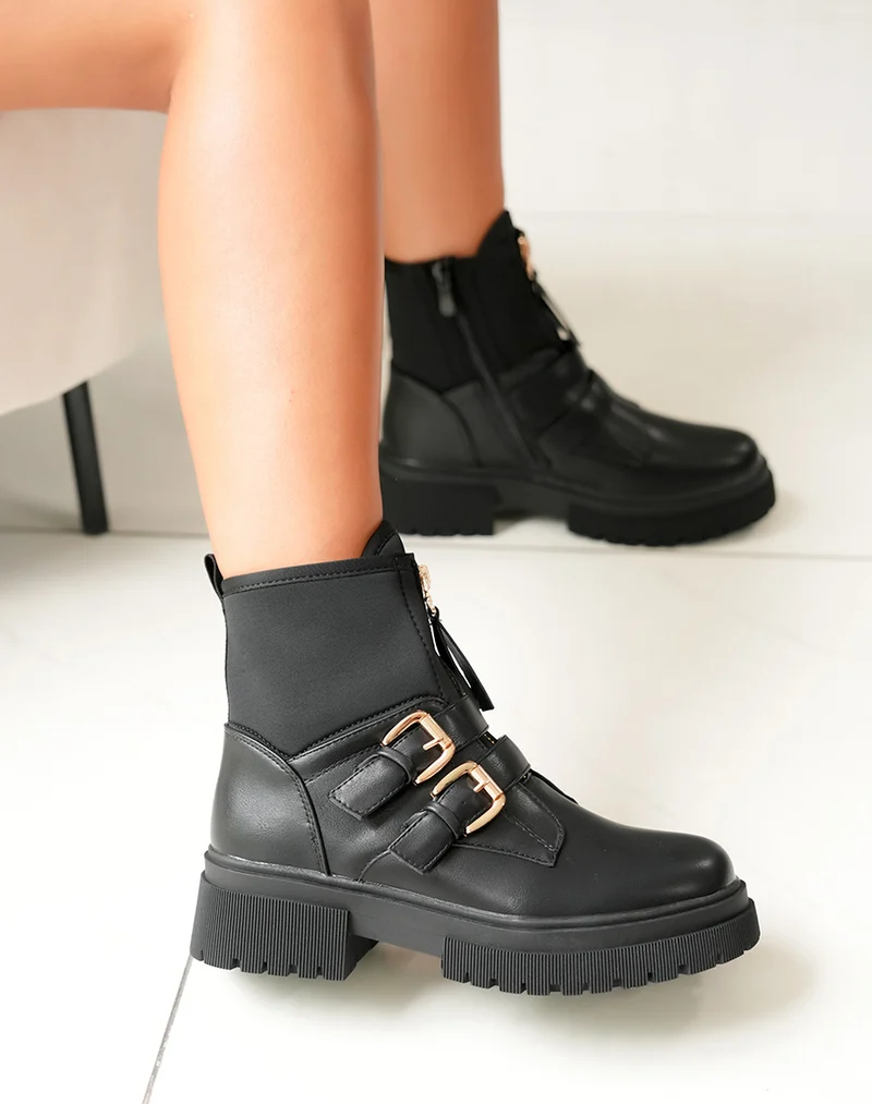 Bottines noires: Zippé et détails dorés