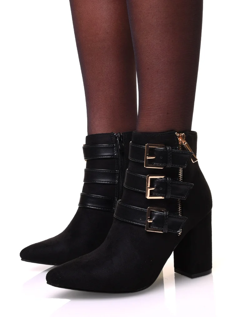 Bottines en suédine à bout pointus et sangles noires