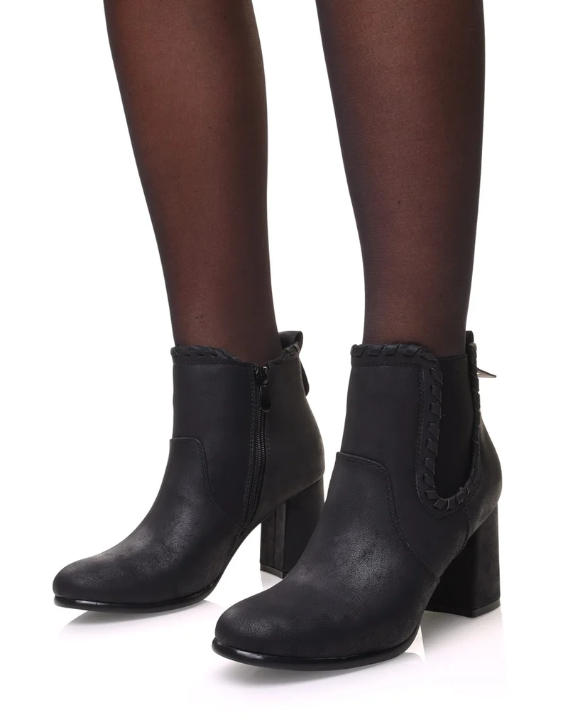 Bottines à talons noires en suédine et détails torsadés