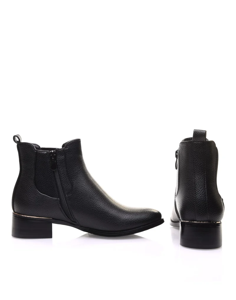 Chelsea boots noires à liseré doré