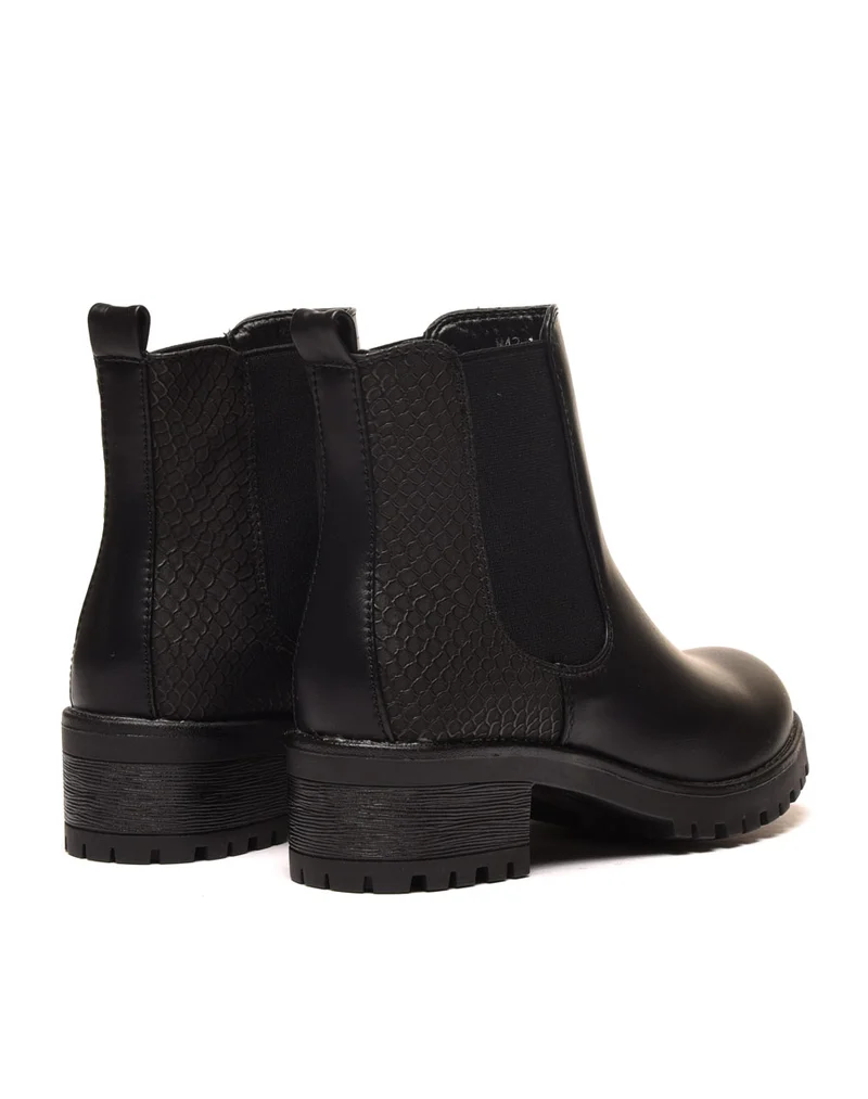 Bottines plates noires avec élastiques et motifs python