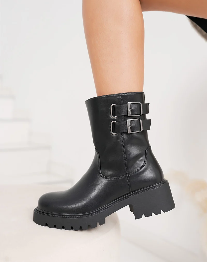 Bottines noires hautes à doubles sangles et semelle crantée