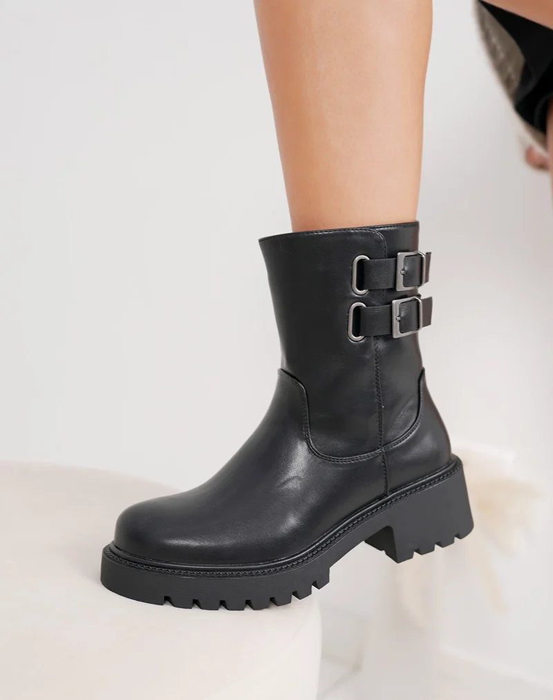 Bottines noires hautes à doubles sangles et semelle crantée