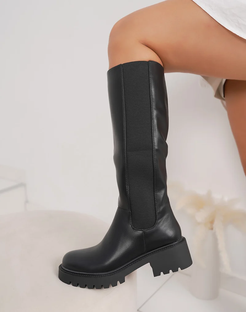 Bottes noires à semelle crantée et élastique latéral