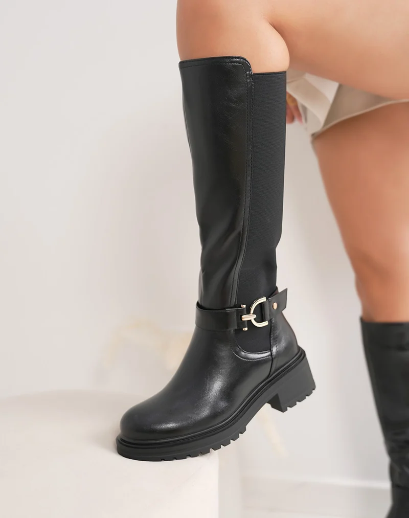 Bottes femme noires style chevalière avec bande élastique et bijou doré